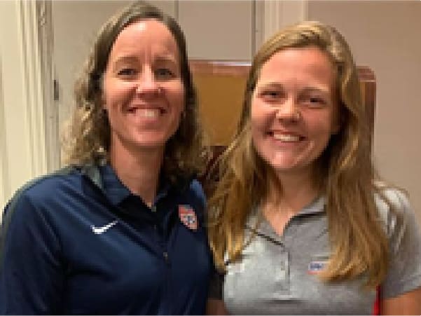 Two women smiling for a picture together.